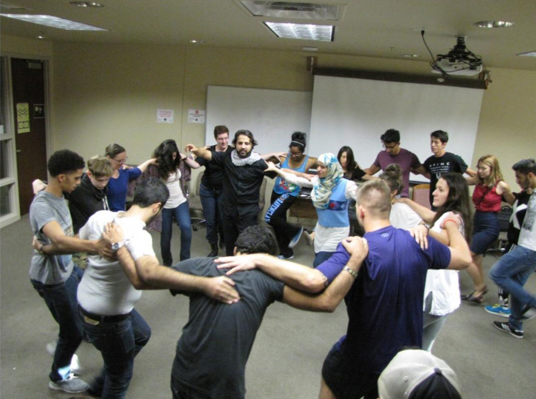 University of Arizona students learning traditional Dabkeh dance