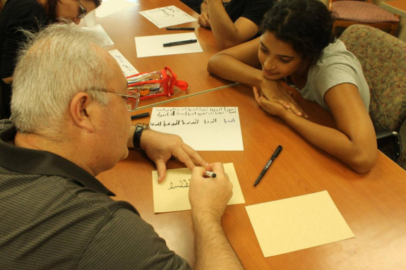 Students writing in Arabic
