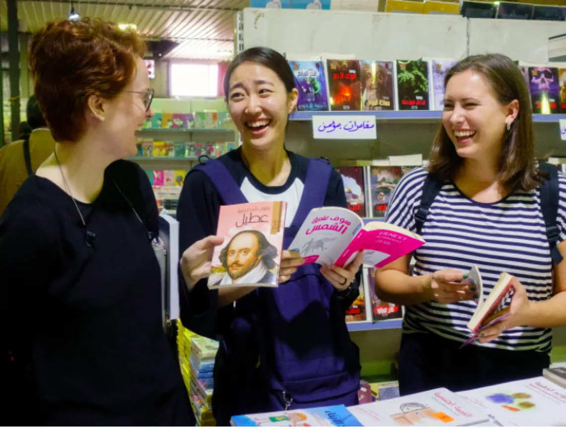 Students laughing in a book store.